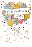 The image shows a tall congratulations card styled as though it has just been set beside a vase of fresh blooms in a cosy Earls Court shop. Its design centres on a graceful cluster of balloons, gathered together like a bouquet and rising toward the top of the card with an easy, buoyant energy. The balloons are softly coloured in champagne and antique gold, brushed silver, powder blue, blush pink and soft grey, each sphere made distinctive with fine decorative touches: tiny metallic stars, delicate stripes, and light dustings of glitter that lend a gentle shimmer, as if lit by evening light filtering down Earls Court Road. Slim ribbons in glinting gold and silver stream down from the base of the cluster, curling and criss-crossing one another as they descend, echoing the flowing lines you might see in a carefully tied hand-tied arrangement. In the centre of the design, a curved banner carries the message Congratulations To You in flowing, elegant script, the letters sweeping across the card in a confident yet warm gesture. Around the balloons and banner, a scattering of stars, soft dots and swirling motifs floats against a pale, almost creamy background, creating a feeling of airy joy and gentle movement, like confetti caught mid-air at a small celebration in nearby Kensington. The card appears to have subtle textural contrasts where glitter and metallic ink sit slightly raised above the smooth cardstock, suggesting a pleasing tactile quality under the fingertips. Overall, it conveys a polished, heartfelt mood, ideal to accompany flowers sent to honour exam successes, new jobs, promotions or any cherished achievement across Earls Court and the neighbouring streets.