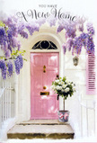 The scene in this photograph feels like a calm pocket of Earls Court, where city life softens at the threshold of home. At the centre stands a pale pink door, its smooth paintwork catching the light in a way that makes the colour feel both modern and romantic. A matching pastel shutter to one side pairs with the door to create a balanced, welcoming façade, while the whitewashed wall behind them reflects a soft, natural brightness. Above, wisteria tumbles in graceful, arching trails, their blooms a rich mix of lavender and lilac that hang in elongated clusters along twisting green stems. The flowers spill down across the frame, framing the doorway like a floral canopy and lending a sense of age and character to the building. Resting on the doorstep is a simple grey metal bucket transformed into a charming floral feature. It cradles a generous bouquet of white and cream roses, the blooms fully open and rounded, with layers of velvety petals that appear almost luminous against the subdued tone of the bucket. Between the roses, small touches of fresh green foliage provide gentle contrast, suggesting the hand of a skilled florist who knows how to keep the arrangement feeling light and natural. Around the base of the bucket, a pink ribbon is tied in a soft bow, mirroring the colour of the door and drawing the eye downward in a subtle echo of the wisteria above. The overall impression is of a new home in Earls Court being quietly celebrated - perhaps flowers just delivered to a doorstep near Earls Court Gardens. The mood is warm, inviting, and full of promise, like the first evening in a place that is already beginning to feel like your own.